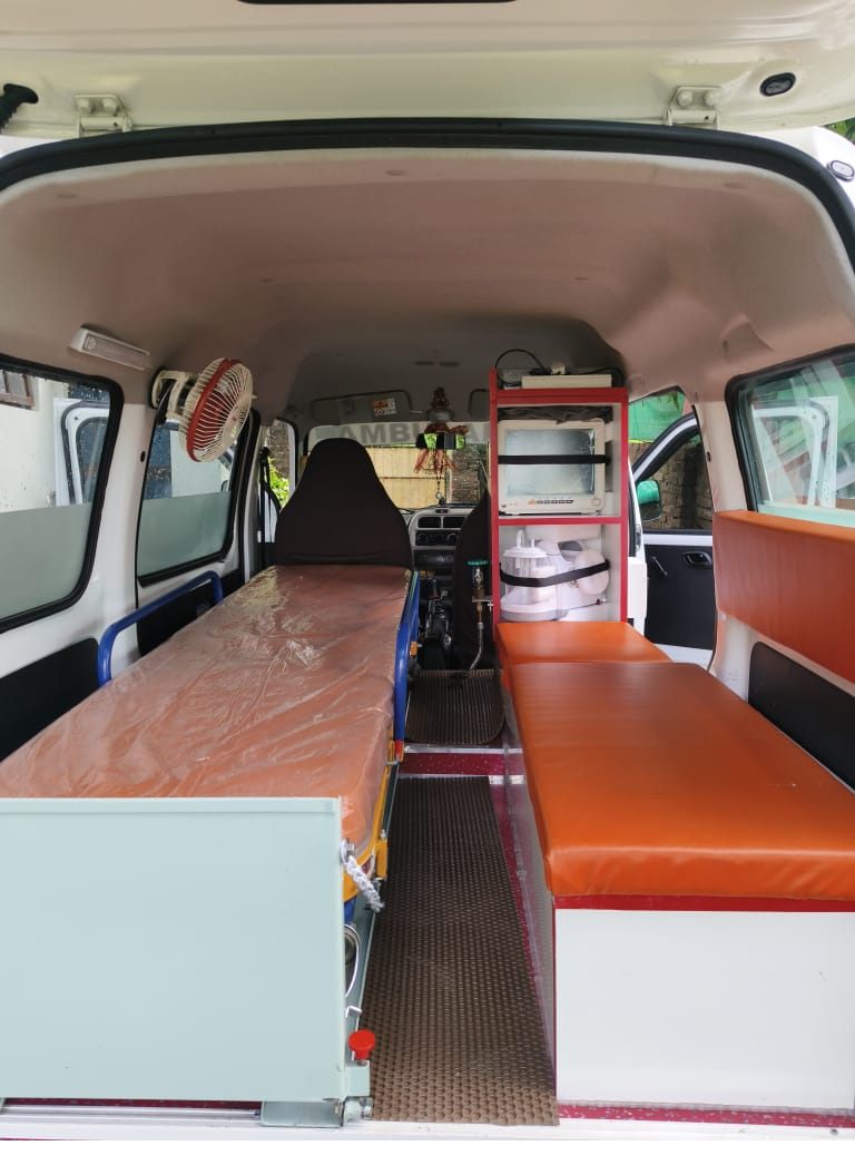 Inside view of a Bittu ambulance showing the equipment cabinet, fan and stretcher